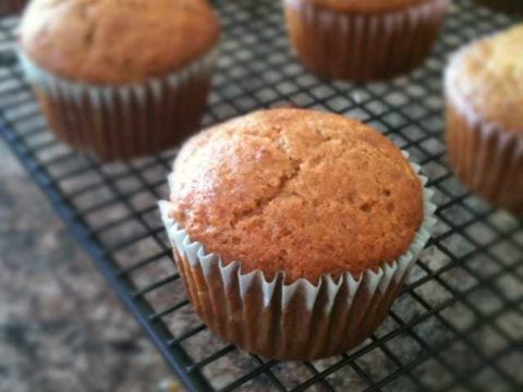 Banana flax muffins sitting on a cooling rack.