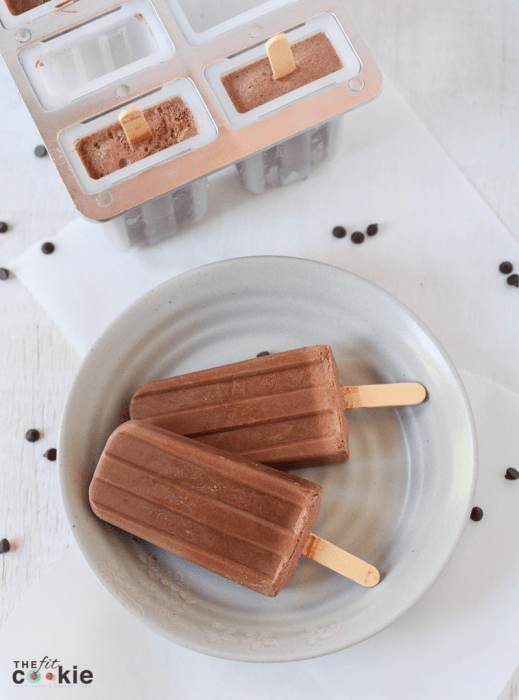 dairy free dark chocolate fudgesicle popsicles on a white plate
