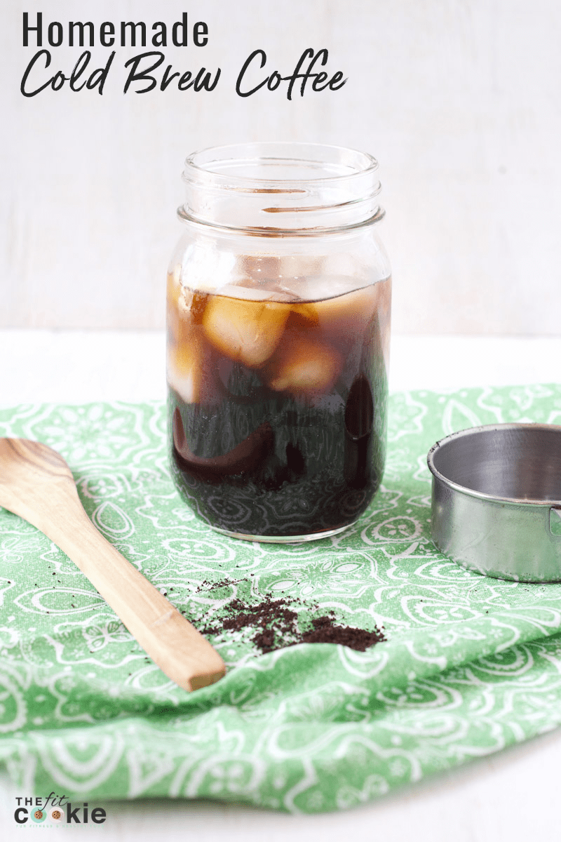 glass jar filled with ice and easy cold brew coffee on a green napkin