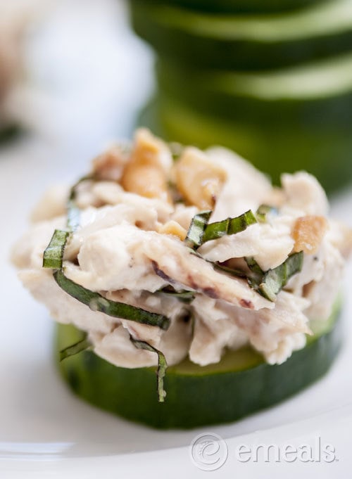 photo of paleo cashew chicken salad on a slice of cucumber