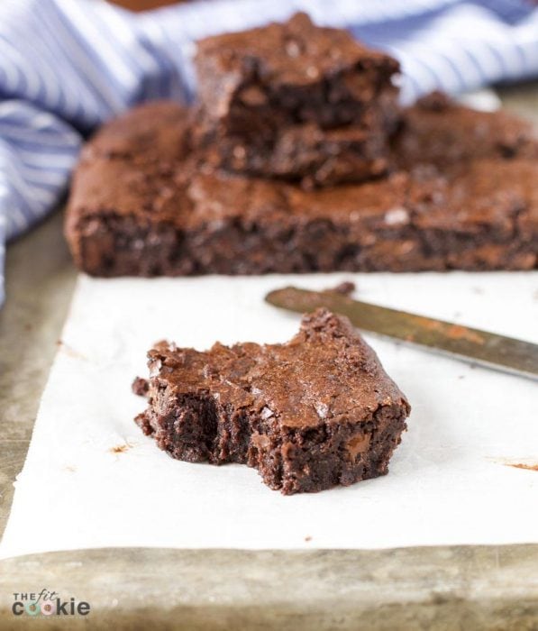 Looking for an allergy friendly brownie recipe? Make a batch of these Vegan One Bowl Fudge Brownies that are gluten free, nut free, and made with simple ingredients you probably already have in your pantry! | TheFitCookiecom #vegan #glutenfree #brownies #chocolate