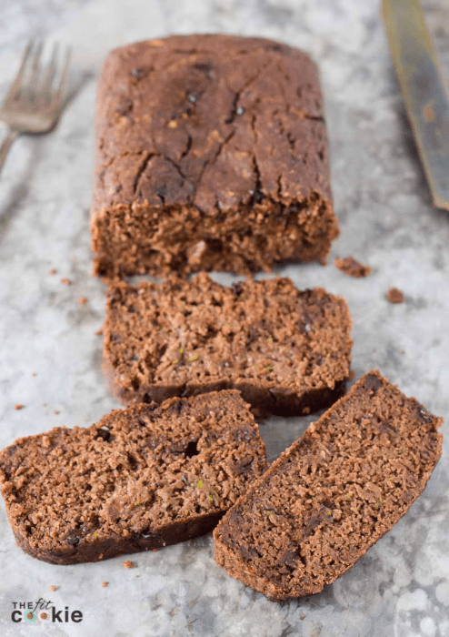This moist zucchini quick bread has a light chocolate flavor that pairs well with the cinnamon and cloves. I remade one of our family recipes to make this Chocolate Zucchini Bread gluten-free, vegan, and allergy friendly! - @TheFitCookie #glutenfree #vegan