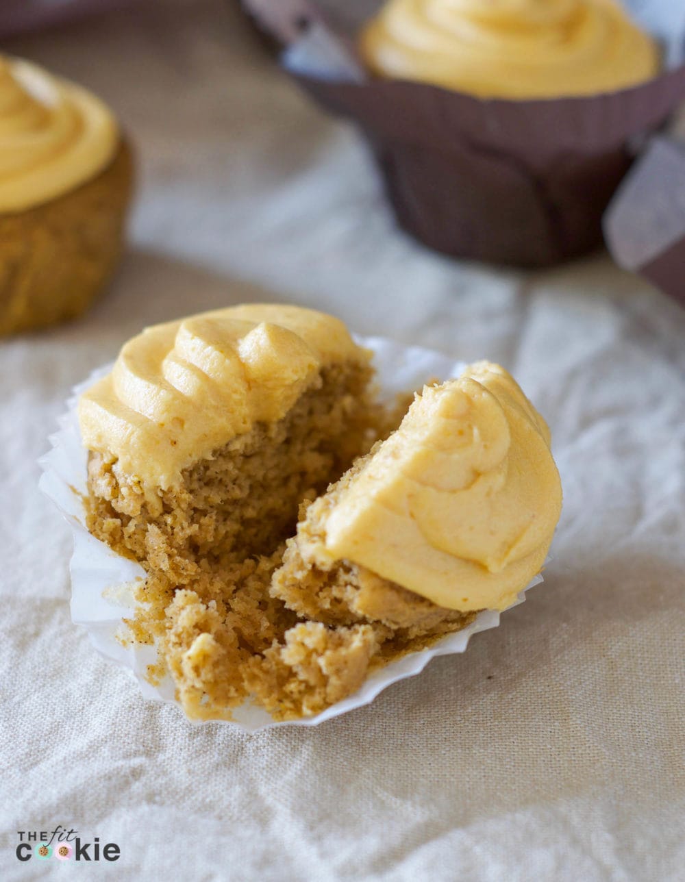 Celebrate fall with some pumpkin cupcakes! These Pumpkin Spice Cupcakes with Pumpkin Buttercream Frosting are gluten free, dairy free, vegan, and nut free. They are an easy and allergy friendly way to add pumpkin spice to your dessert menu - @TheFitCookie #glutenfree #dairyfree #vegan #pumpkin 