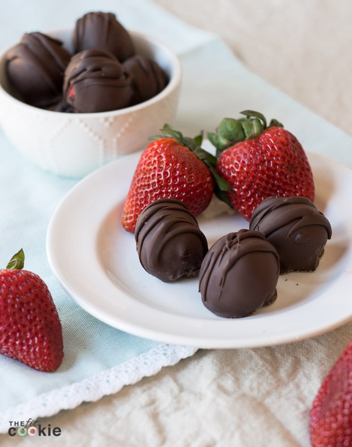 These Strawberry Coconut Truffles have the perfect ratio of chocolate and strawberry filling, and they make a beautiful homemade gift. The filling is made with simple and allergy-friendly ingredients so they are gluten-free and vegan, and fit many special diets. But everyone can enjoy these treats even if they don't have food allergies! - TheFitCookie.com