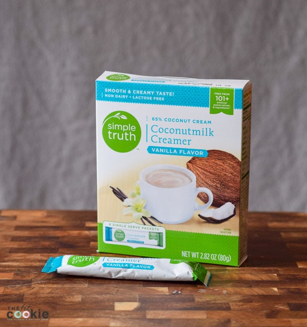 If you're struggling with soy allergies or food allergies in general, finding great alternatives for traditional ingredients can be tough, but it can be done! Here are our favorite soy free cooking products that we use in our kitchen - @TheFitCookie | powdered coconutmilk creamer box on a wood cutting board |