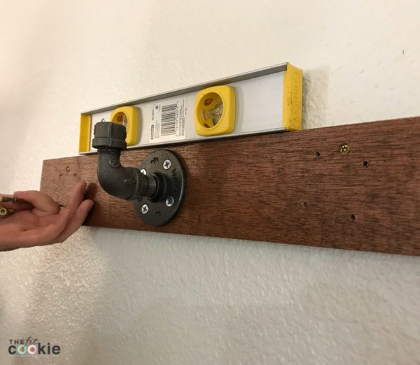 Looking for a fun home project you can tackle in a day or 2? See how we made a couple sets of rustic industrial wall hooks for our home! - @TheFitCookie #home #DIY #crafts