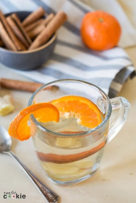 Support your immune system this winter with this delicious and super easy Ginger Orange Wellness Tea that you can make with whole, simple ingredients in less than 15 minutes - @TheFitCookie #health #paleo #vegan