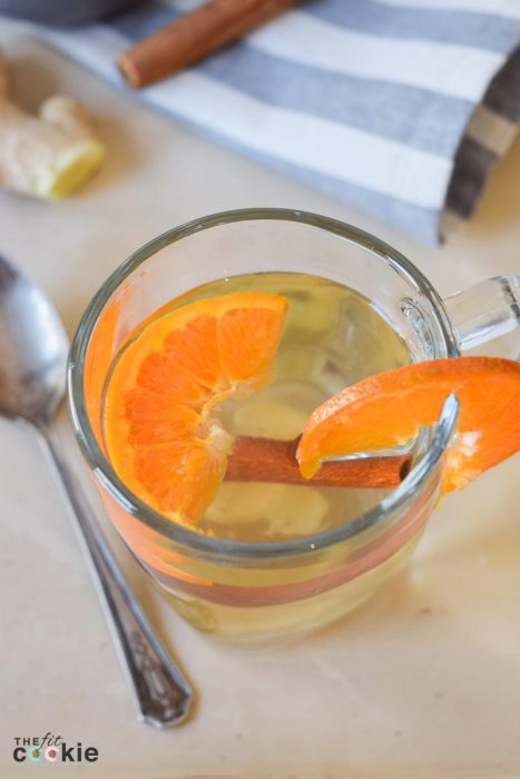 Support your immune system this winter with this delicious and super easy Ginger Orange Wellness Tea that you can make with whole, simple ingredients in less than 15 minutes - @TheFitCookie #health #paleo #vegan