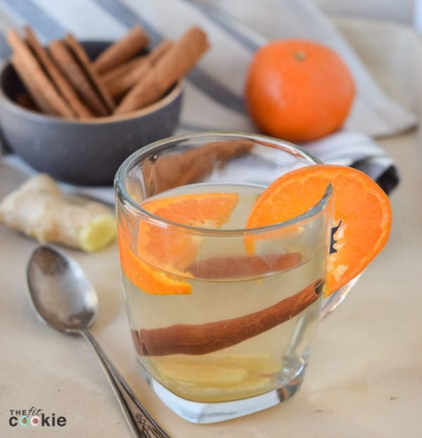 Support your immune system this winter with this delicious and super easy Ginger Orange Wellness Tea that you can make with whole, simple ingredients in less than 15 minutes - @TheFitCookie #health #paleo #vegan