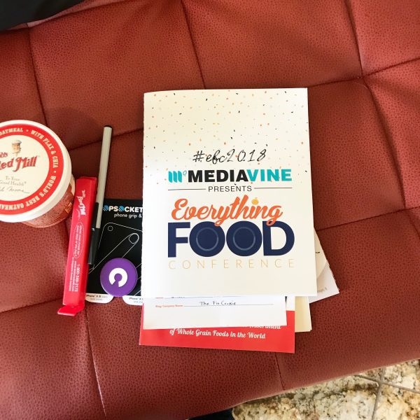 everything food conference schedule on a red sofa