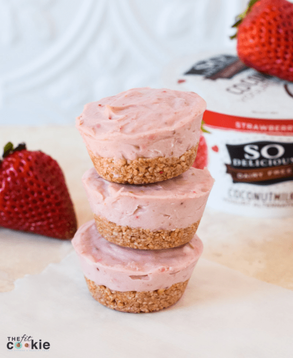 stack of gluten free vegan strawberry cheesecakes on parchment paper