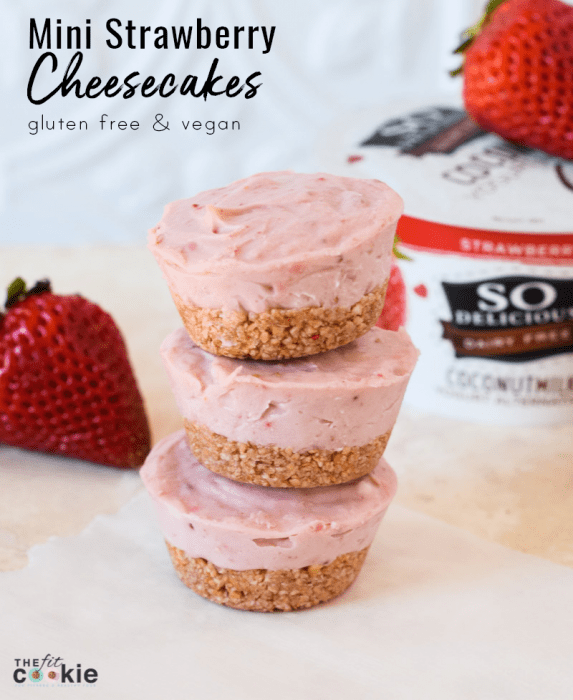mini vegan strawberry cheesecakes stacked on parchment paper, with words overlaid on image