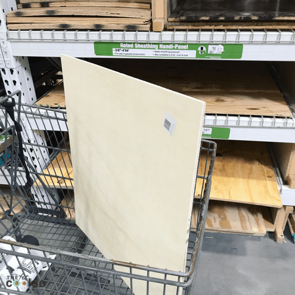birch plywood board in a cart at the lumber store for making diy food photography backgrounds with chalk paint