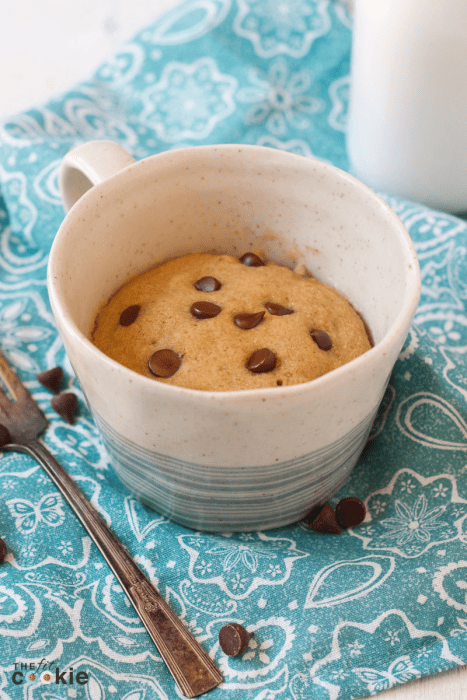 Bake a delicious cake without turning on your oven! This little gluten free Chocolate Chip Mug Cake is perfect for one (or two if you want to share!). This mug cake is not only gluten free, it's also dairy free, vegan, and nut free - @TheFitCookie #glutenfree #vegan #cake