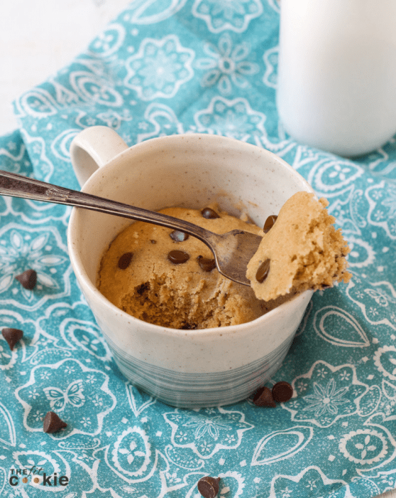 Bake a delicious cake without turning on your oven! This little gluten free Chocolate Chip Mug Cake is perfect for one (or two if you want to share!). This mug cake is not only gluten free, it's also dairy free, vegan, and nut free - @TheFitCookie #glutenfree #vegan #cake