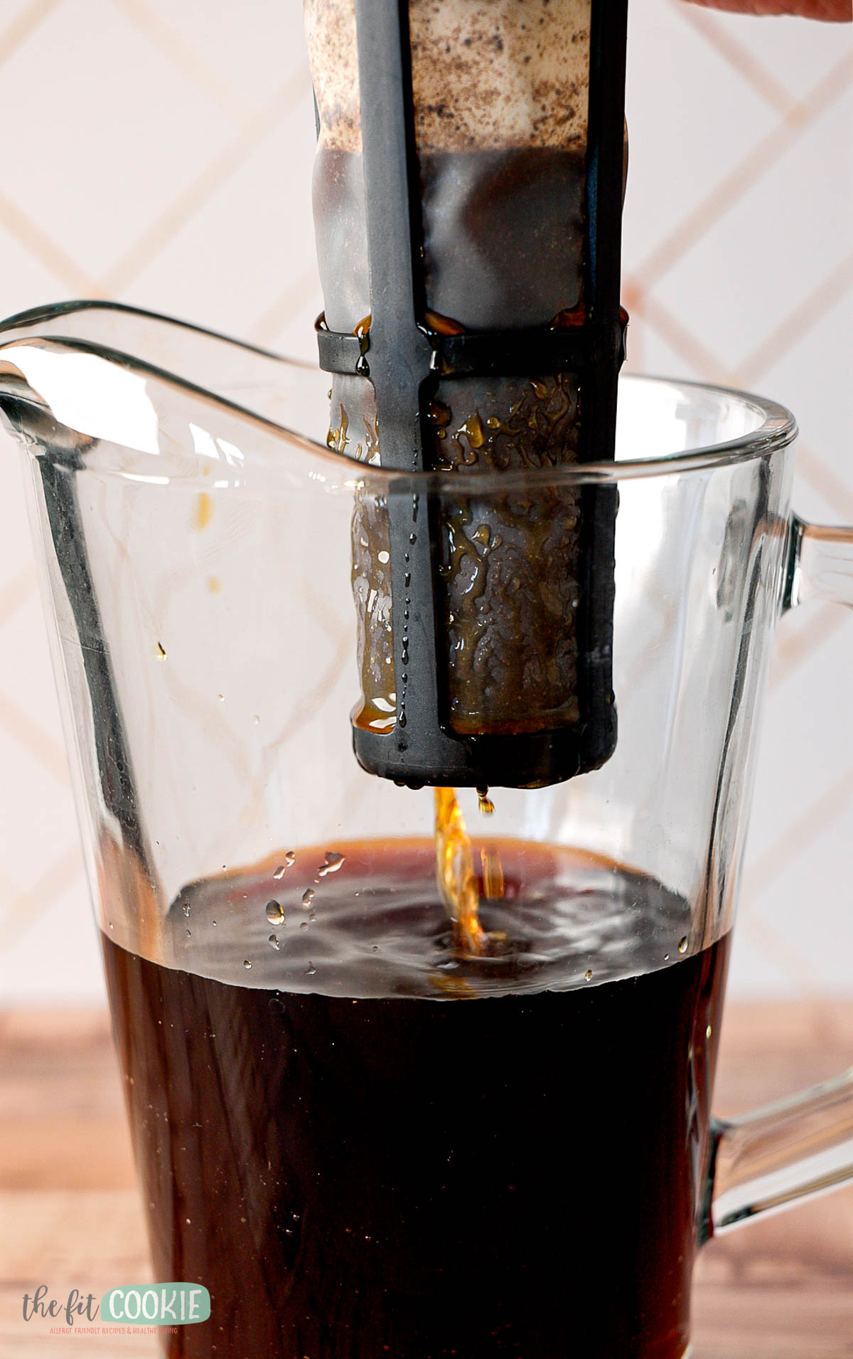 Close-up of a coffee filter with cold brew filtering through.