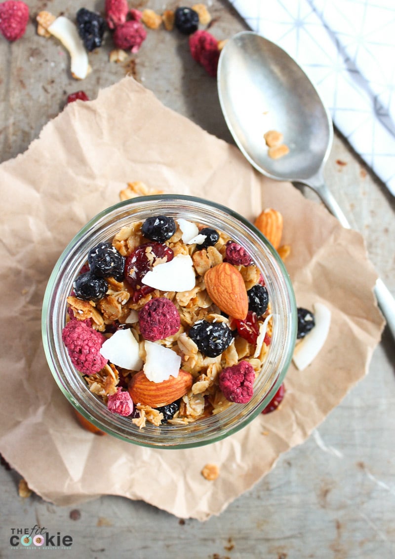 overhead photo of gluten free granola with nuts and berries