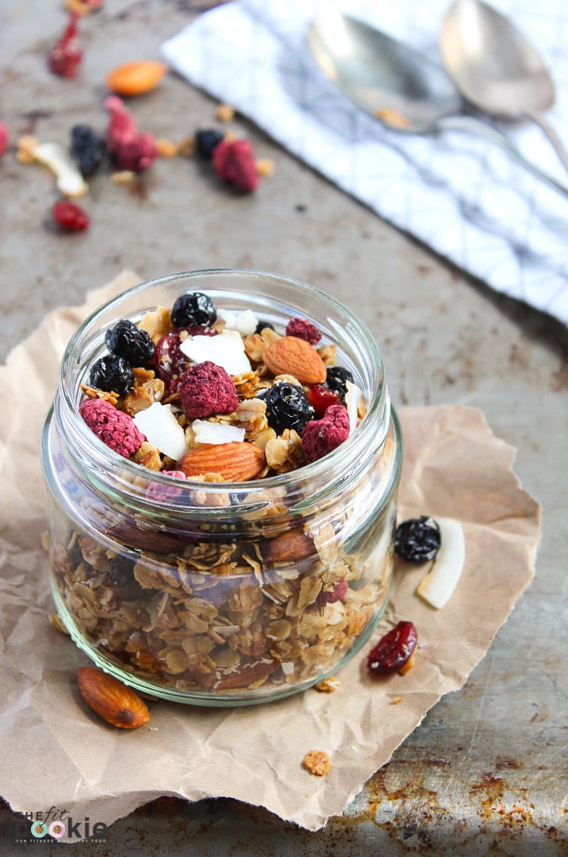 jar filled with gluten free summer berry granola with almonds and coconut pieces