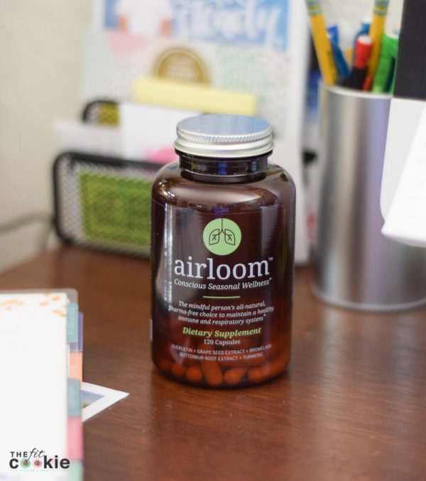 bottle of airloom seasonal wellness supplement on a desk