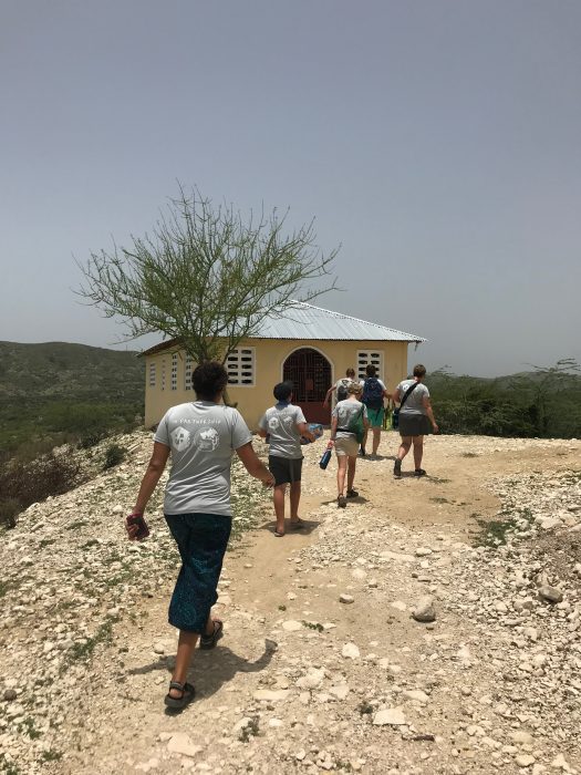 our missions team hiking to the hilltop church in Haiti 