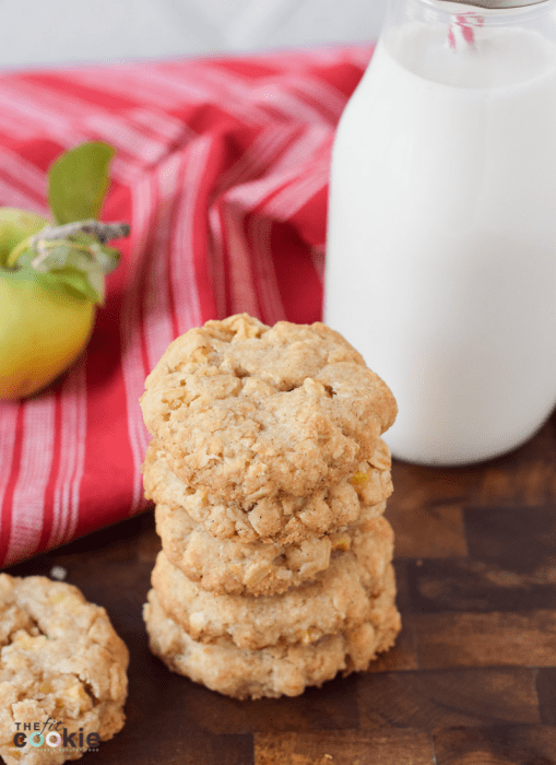 tall stack of gluten free apple oatmeal cookies next to a red napkin