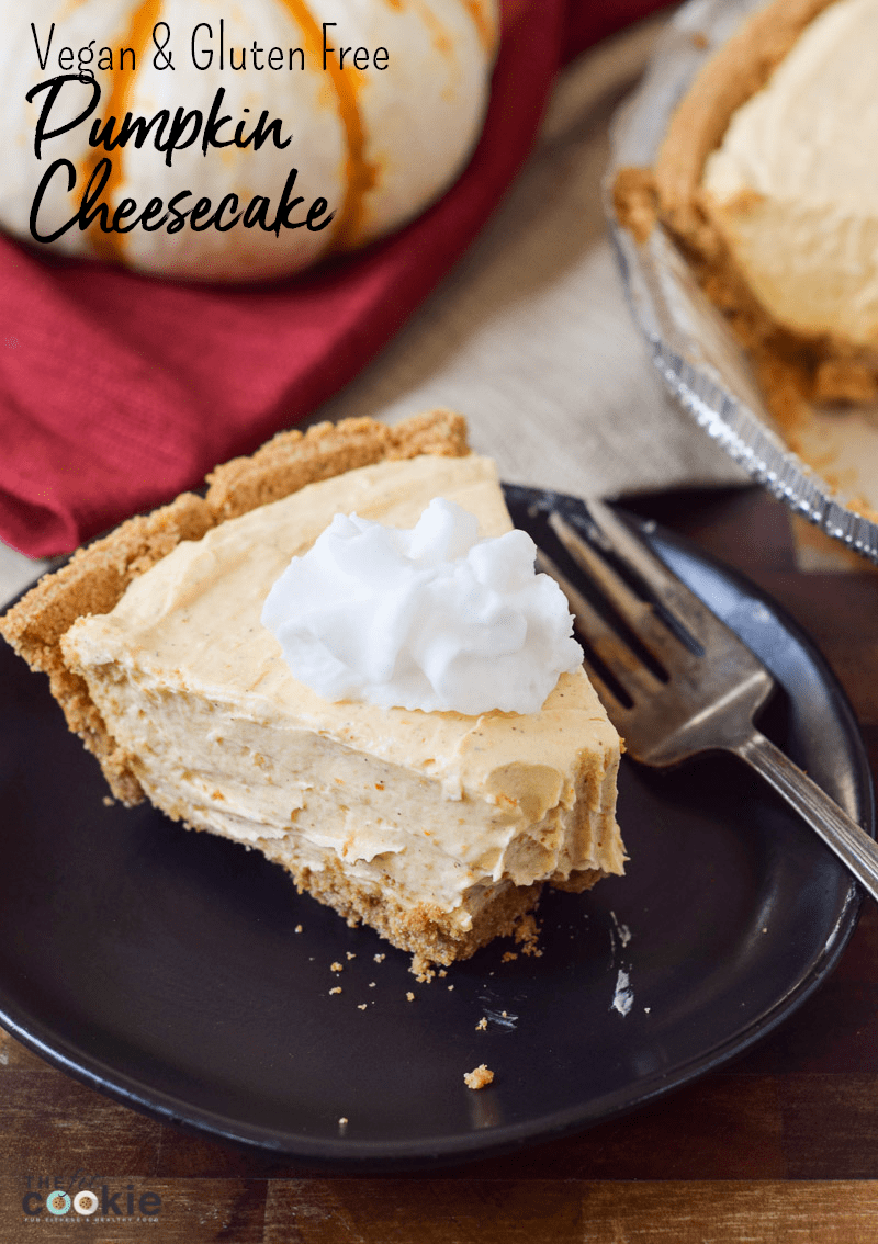 slice of vegan no bake pumpkin cheesecake on a black plate with a bite missing