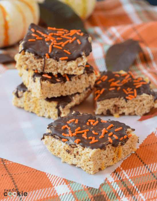 dairy free gluten free pumpkin spice rice crispy treats with chocolate and orange sprinkles on top