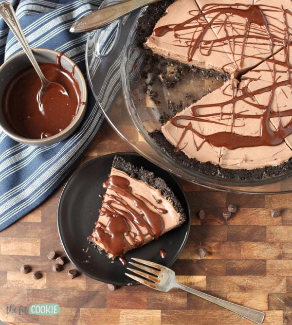 overhead photo of chocolate cheesecake slice on a black plate