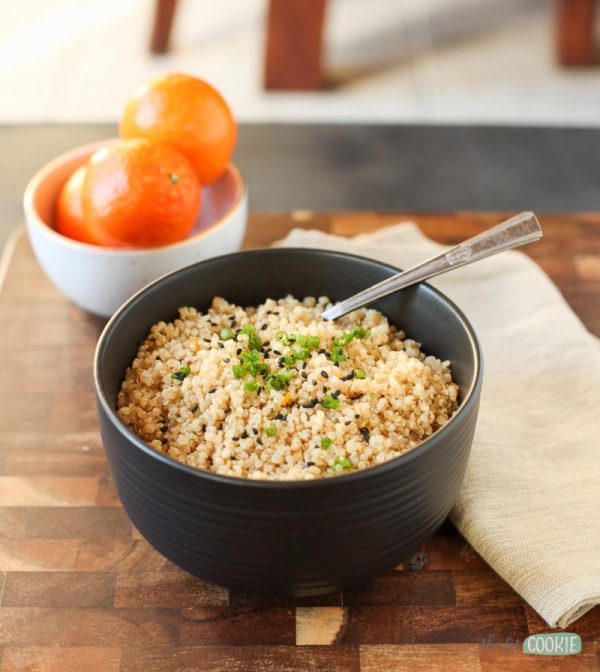black bowl full of gluten free pressure cooker sesame orange quinoa with black sesame seeds