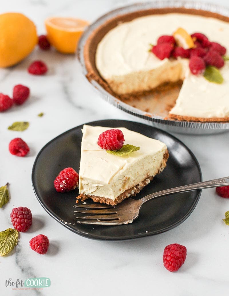 slice of dairy free gluten free lemon cheesecake with a bite taken