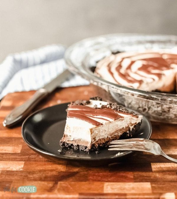 slice of dairy free sunbutter cheesecake on a plate with a fork
