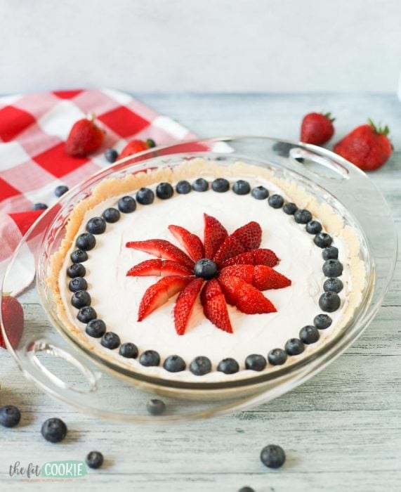 photo of dairy free no bake vanilla cheesecake in a glass pan