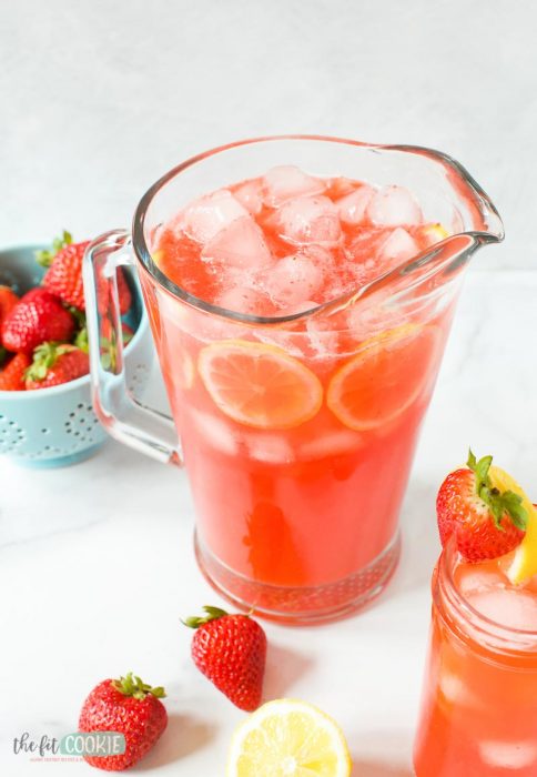 glass pitcher of sparkling strawberry lemonade with ice