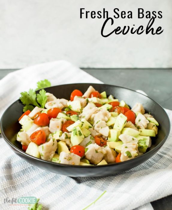 sea bass ceviche in a black bowl with text overlay