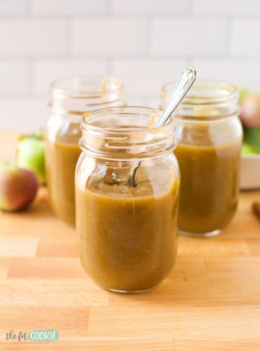 jars of instant pot apple butter with spoon.