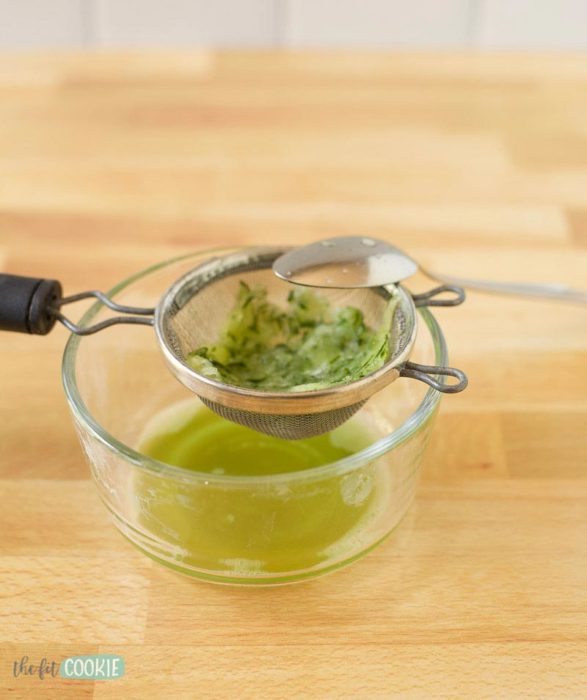 straining grated zucchini for tzatziki