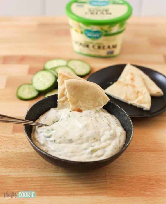 pita bread in bowl of dairy free tzatziki sauce