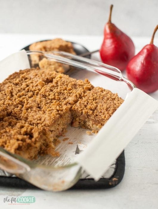 coffee cake in a glass pan with 2 pieces removed 