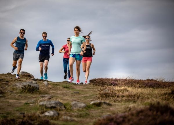 group of people cross country running