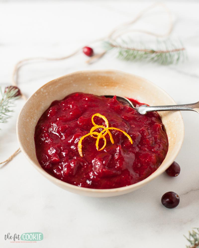 tan bowl filled with homemade cranberry sauce