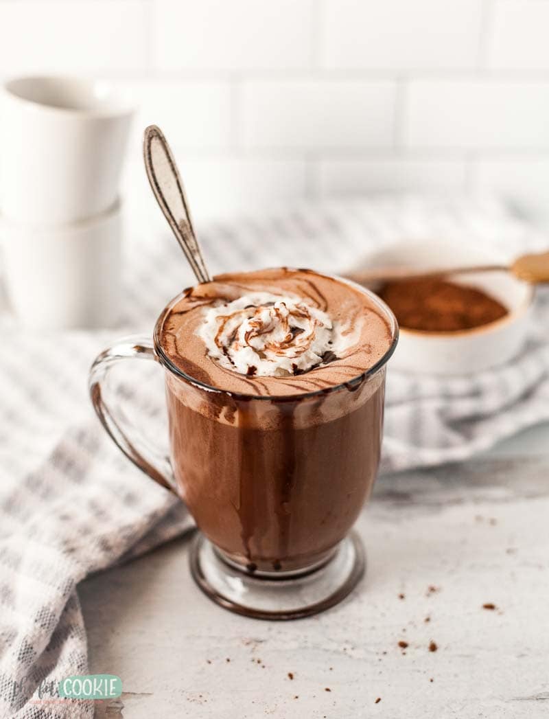 glass of dairy free hot chocolate with whipped cream