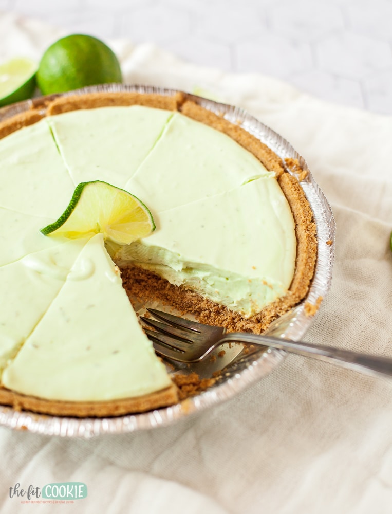 sliced dairy free key lime cheesecake with slice removed