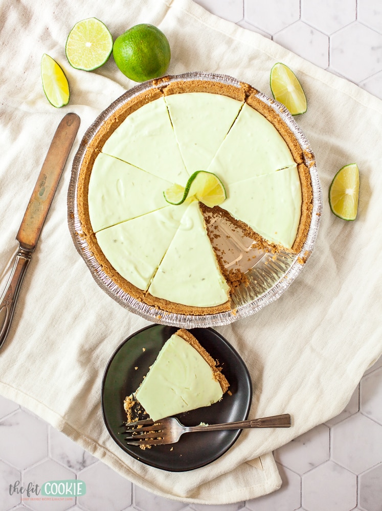 overhead photo of key lime cheesecake with slice removed 