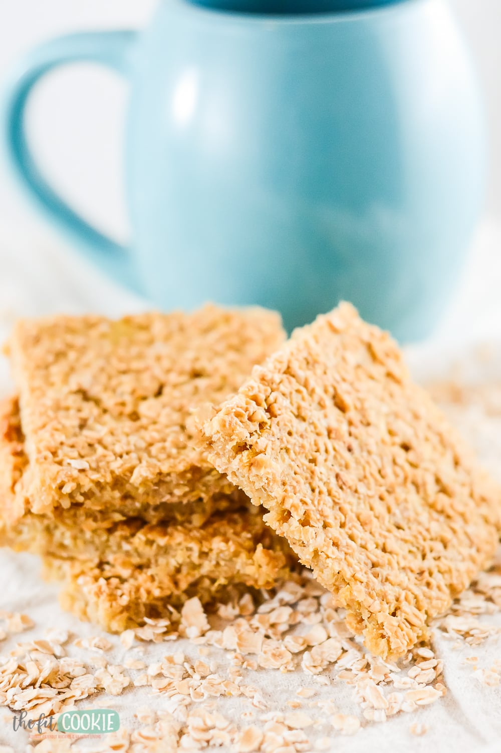 stack of pineapple snack bars next to blue mug