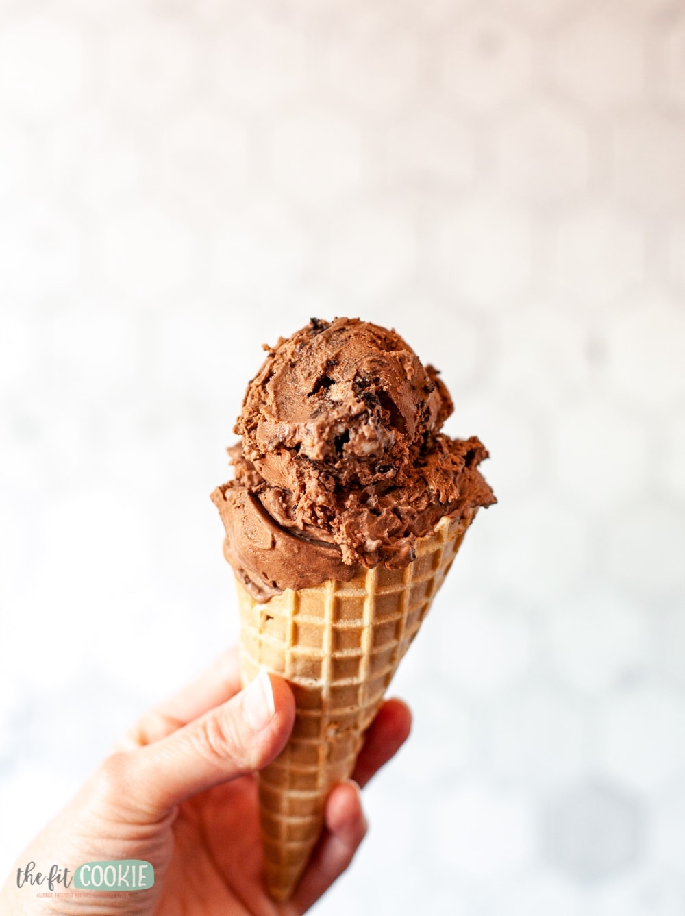 chocolate ice cream on a waffle cone