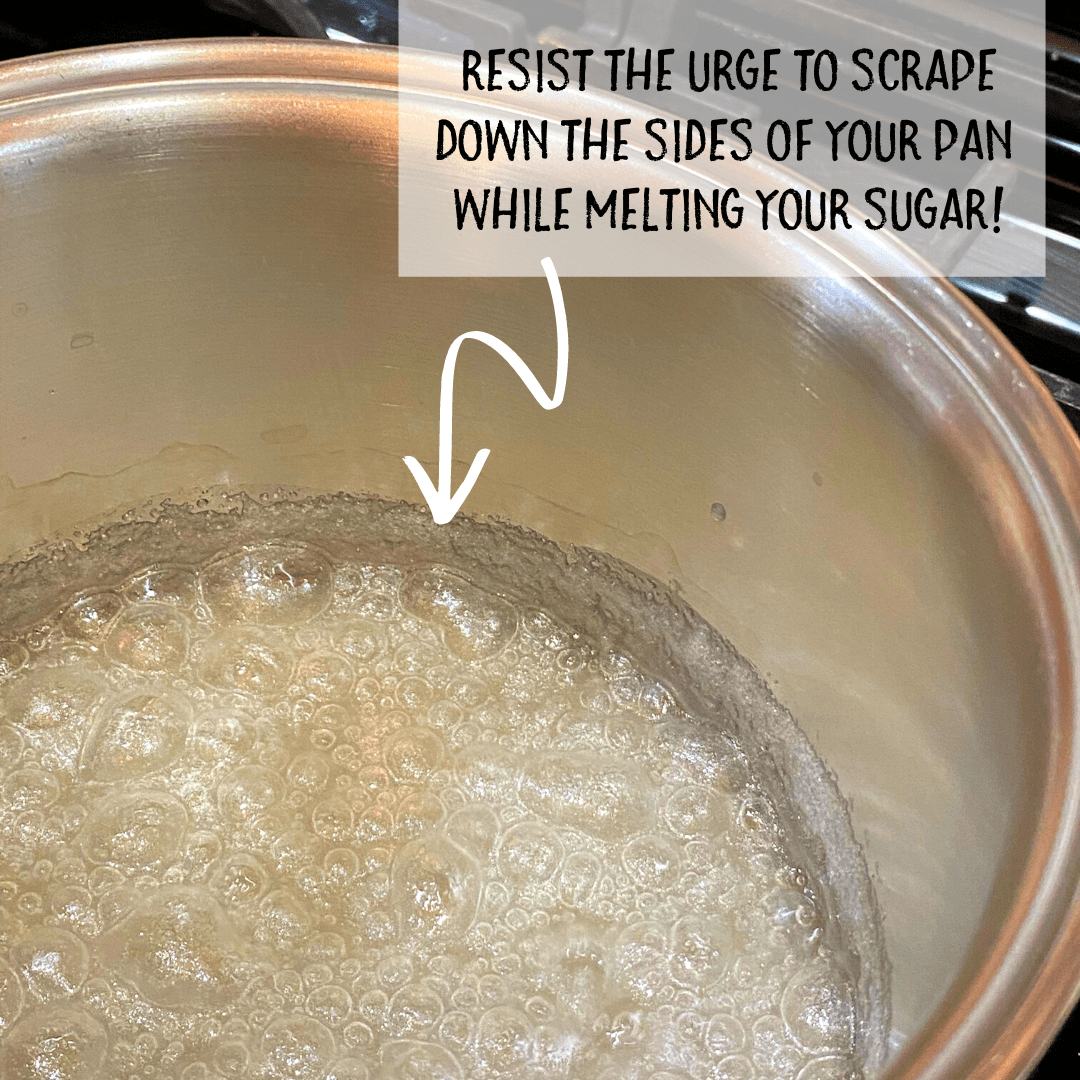 photo of saucepan of melting sugar and water.