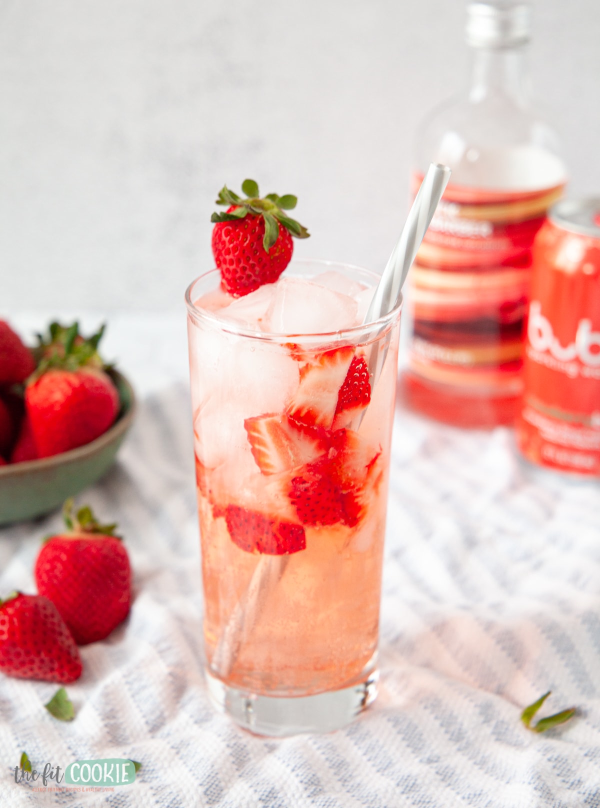 photo of glass with strawberry rhubarb sparkling mocktail. 