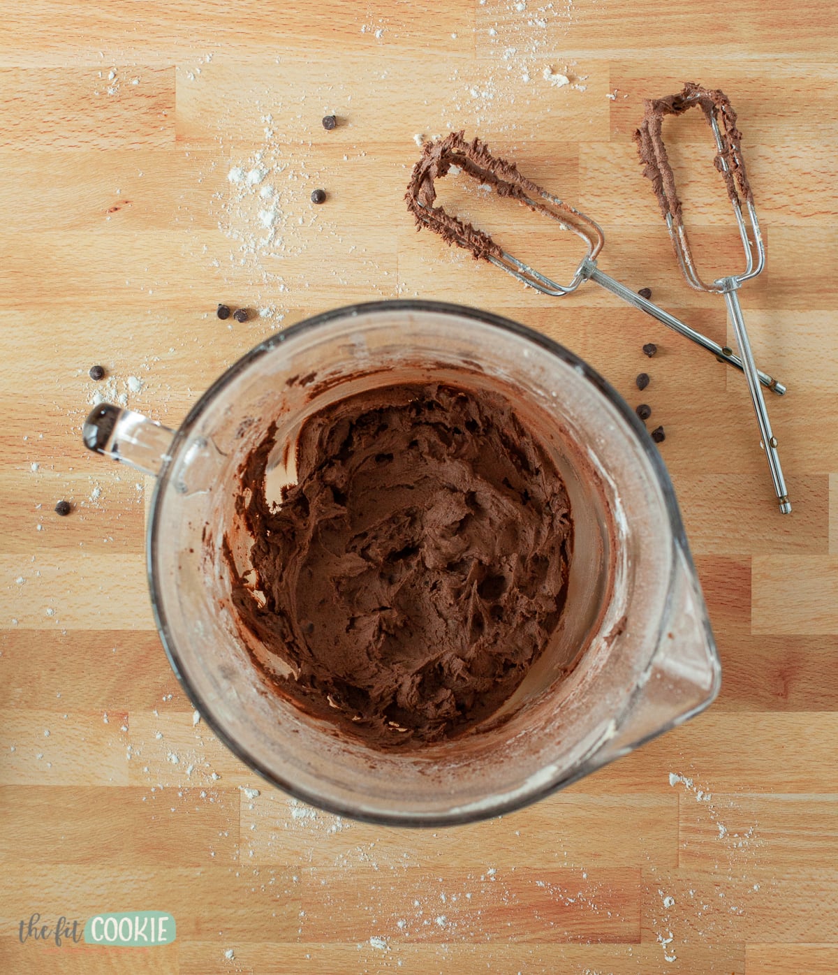 overhead photo of glass bowl filled with brownie batter