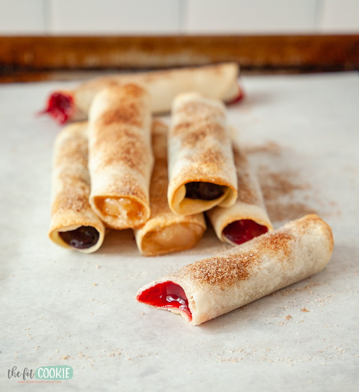 fruit flautas on a pan with parchment paper