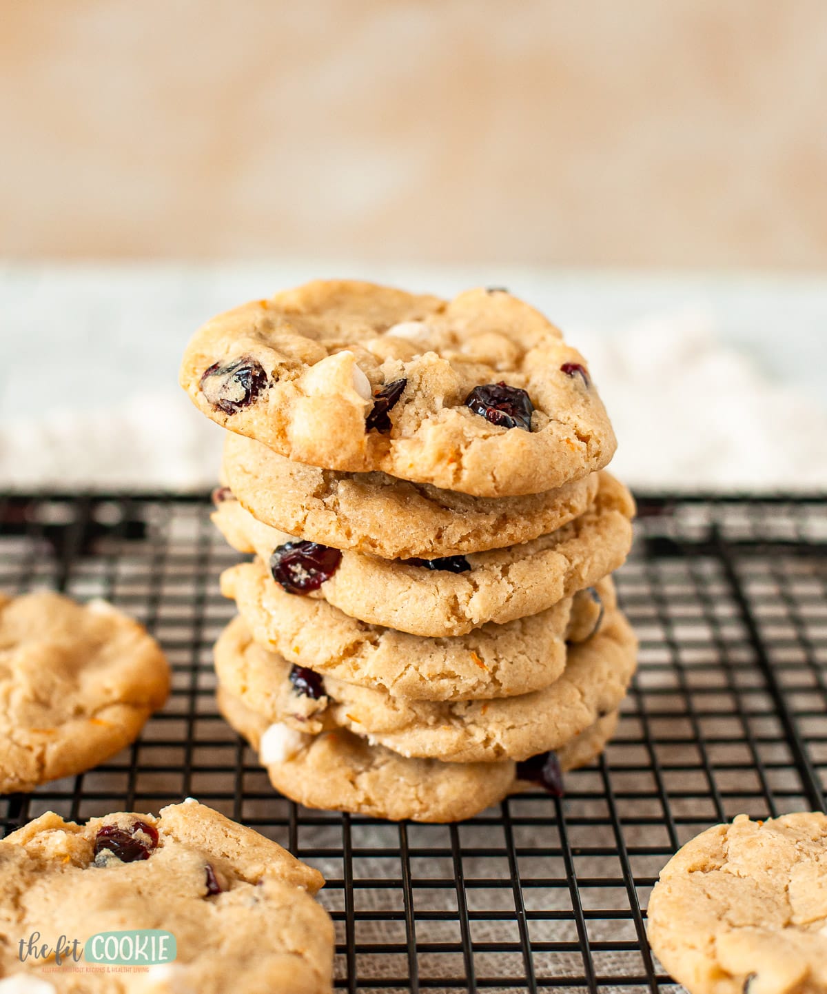 close up photo of white chocolate chip cookies in a stack